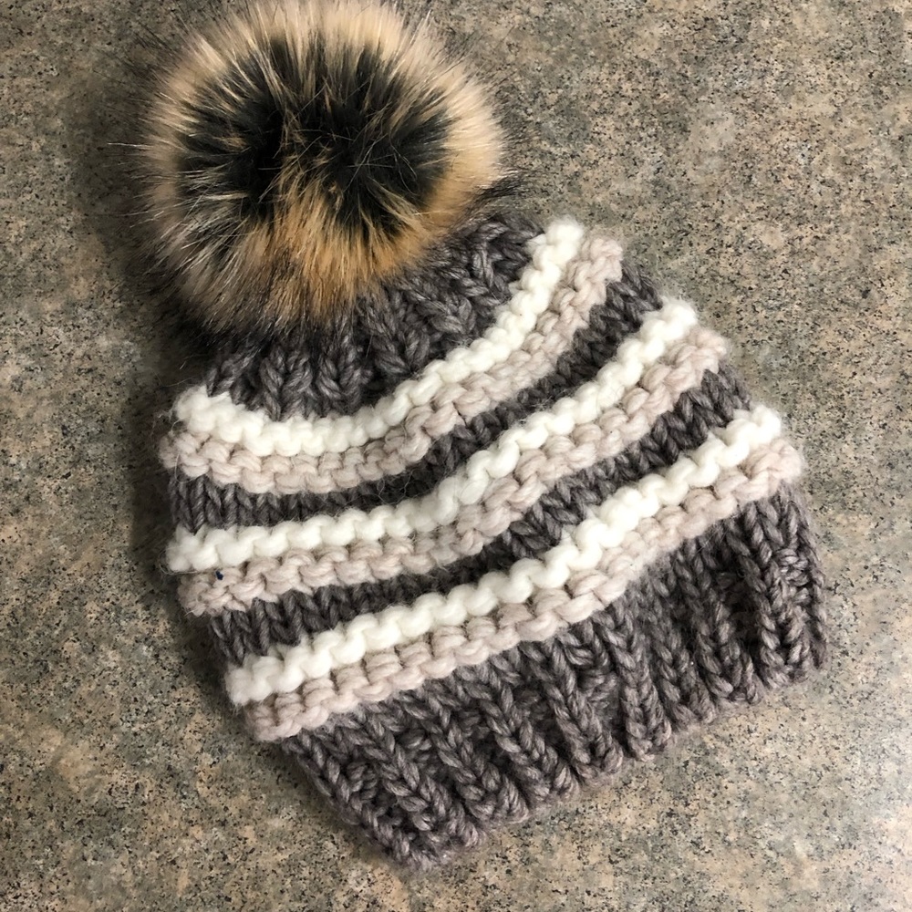Grey white and brown puff winter hat
